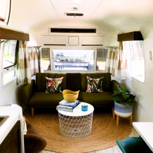 Tour this Renovated Airstream from Trailer Trashin' with Modern Finishes and Tropical Vibes! Featured on MountainModernLife.com