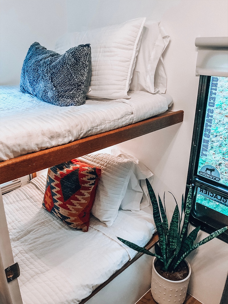 See how a passion for international travel influenced the interior design of this camper renovation! / Photos by @ems_traveldiary / Featured on MountainModernLife.com #camperrenovation