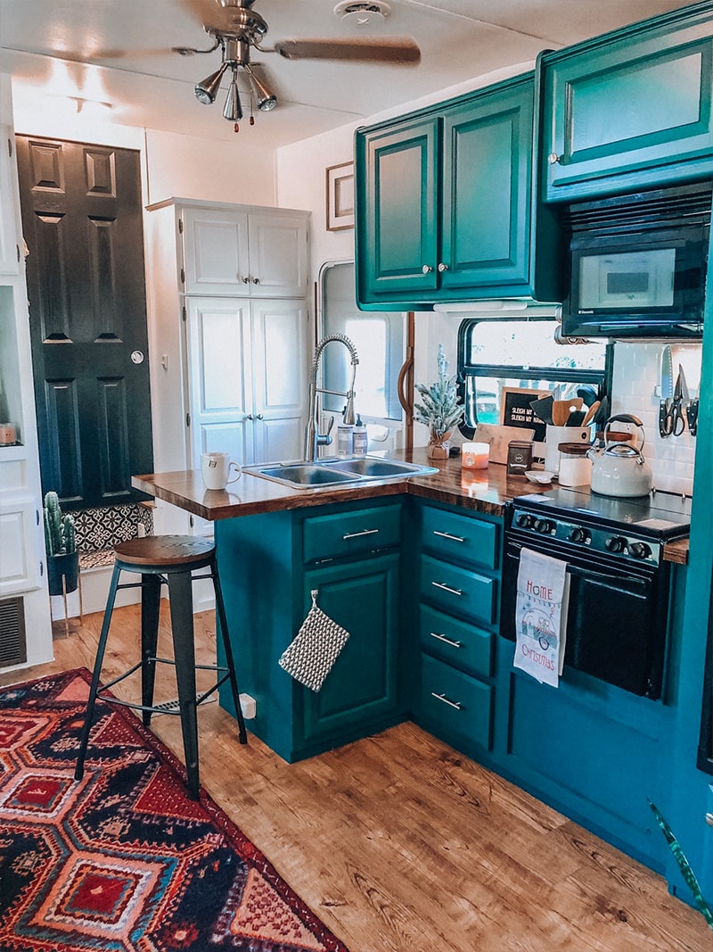 See how a passion for international travel influenced the interior design of this camper renovation! / Photos by @ems_traveldiary / Featured on MountainModernLife.com #camperrenovation