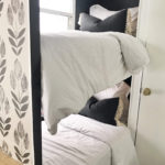 Tour this budget-friendly farmhouse camper that was transformed for $500 by Proverbs31Girl! Featured on MountainModernLife.com