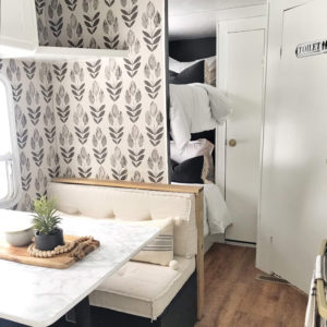 Tour this budget-friendly farmhouse camper that was transformed for $500 by Proverbs31Girl! Featured on MountainModernLife.com