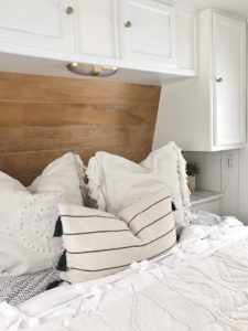 Tour this budget-friendly farmhouse camper that was transformed for $500 by Proverbs31Girl! Featured on MountainModernLife.com