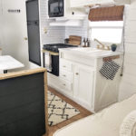 Tour this budget-friendly farmhouse camper that was transformed for $500 by Proverbs31Girl! Featured on MountainModernLife.com