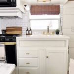 Tour this budget-friendly farmhouse camper that was transformed for $500 by Proverbs31Girl! Featured on MountainModernLife.com