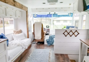 Tour this modern yet cozy renovated RV filled with lots of white, shiplap, and warm wood tones from @WilsonGrandAdventures! Featured on MountainModernLife.com