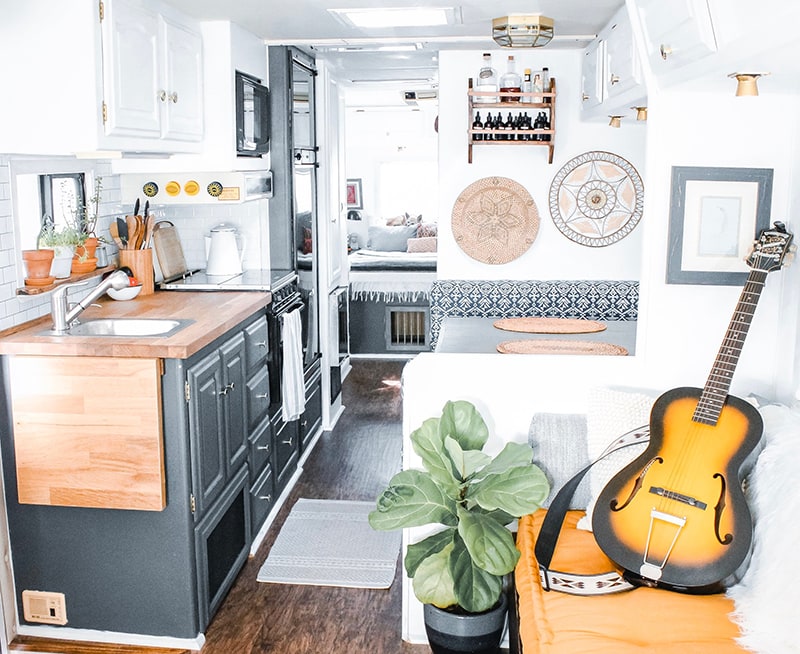 This couple lives on a blueberry farm in their bohemian-inspired RV! View the tour from @The_Ramblr_RV on MountainModernLife.com