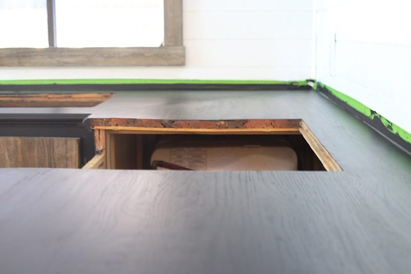 Considering adding black kitchen countertops to your home? Come see how we updated butcher block countertops for a rustic modern vibe in our RV. MountainModernLife.com