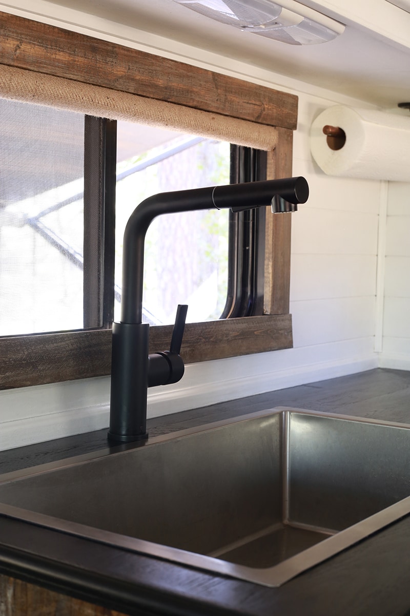 Considering adding black kitchen countertops to your home? Come see how we updated butcher block countertops for a rustic modern vibe in our RV. MountainModernLife.com