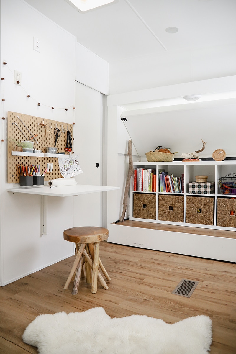 Tour this modern RV with old world charm from @r.maria.fuller that has wood beams that will make you swoon! See the before and after on MountainModernLife.com