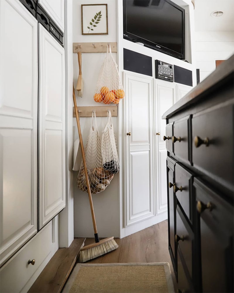 Tour this modern RV renovation with old world charm from @r.maria.fuller that has wood beams that will make you swoon! See the before and after on MountainModernLife.com