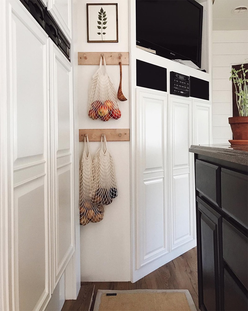 Tour this modern RV with old world charm from @r.maria.fuller that has wood beams that will make you swoon! See the before and after on MountainModernLife.com