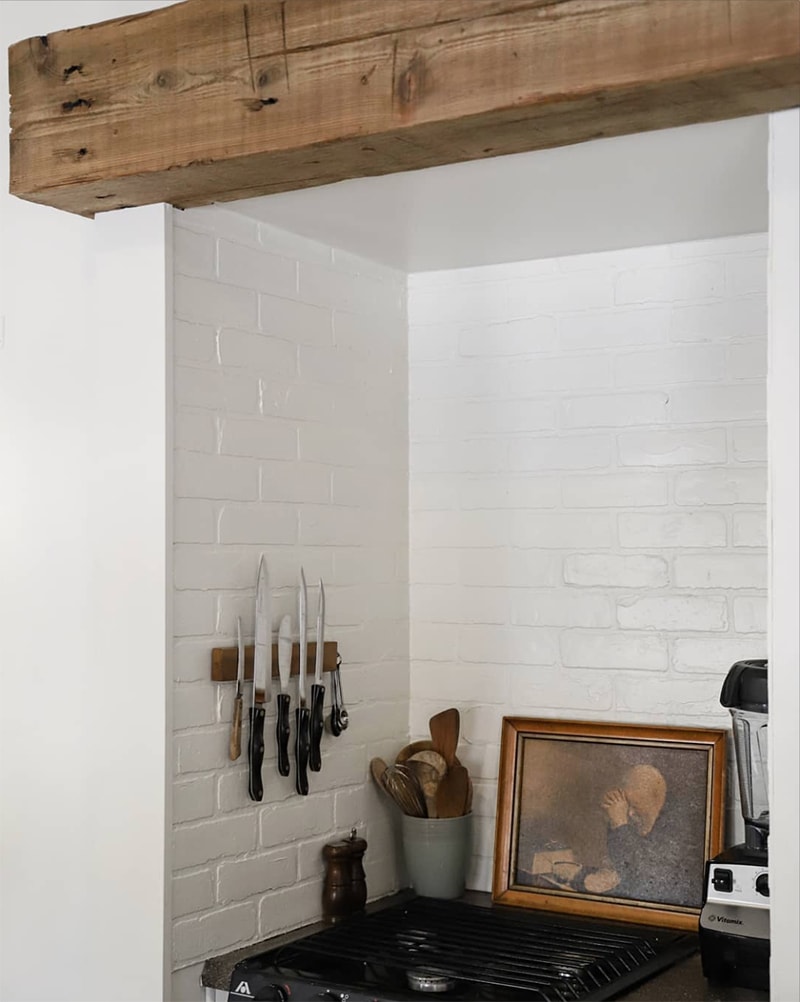 Tour this modern RV renovation with old world charm from @r.maria.fuller that has wood beams that will make you swoon! See the before and after on MountainModernLife.com