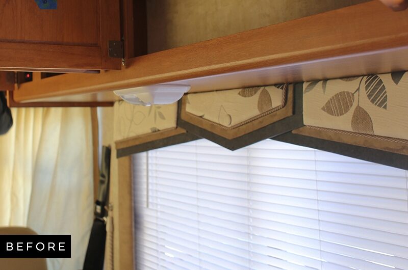 Outdated RV light fixture above sofa