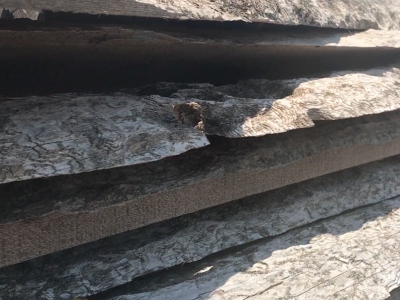 Stack of reclaimed wood air drying | MountainModernLife.com