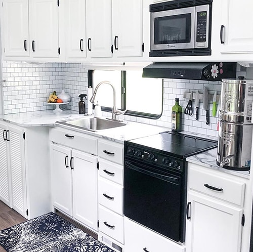 White RV Kitchen Interior from @fifthwheelfarmhouse