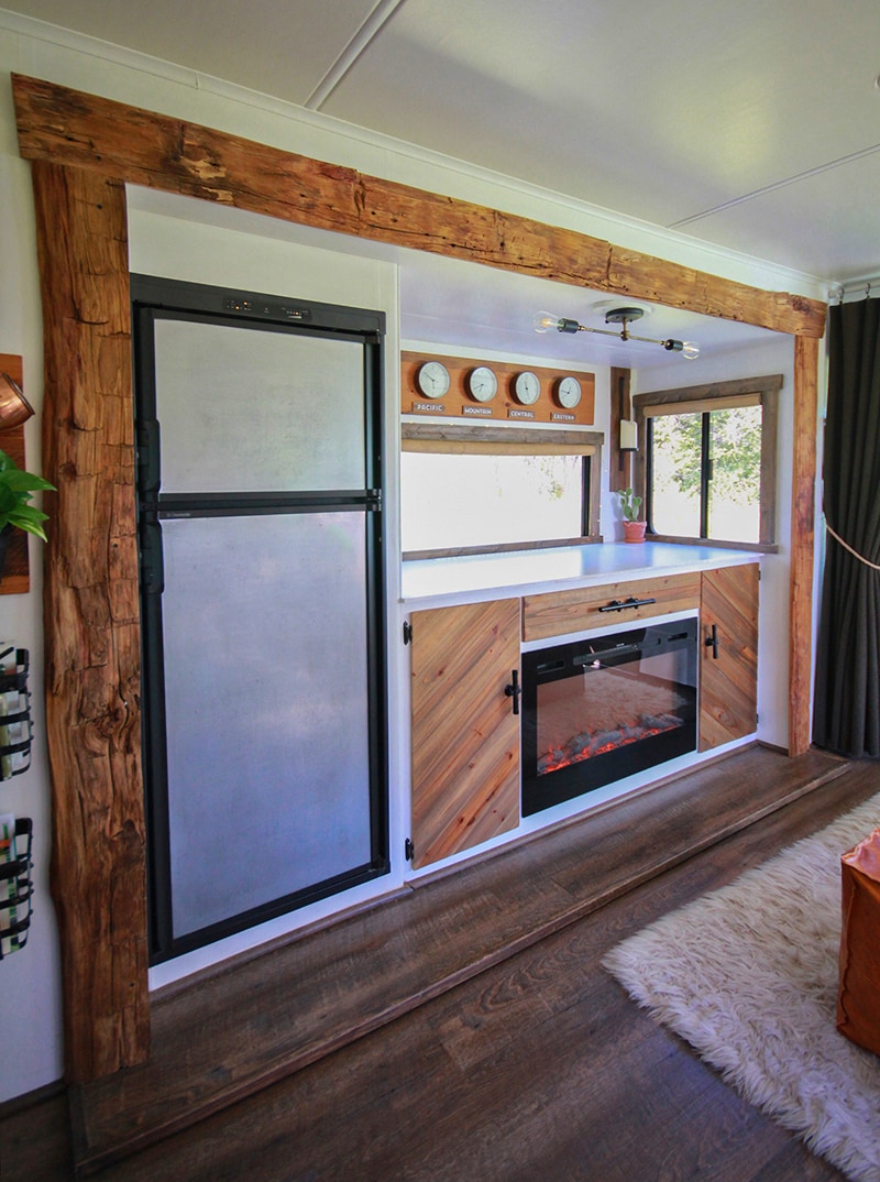 Rustic RV with hand-hewn barnwood around slide-out