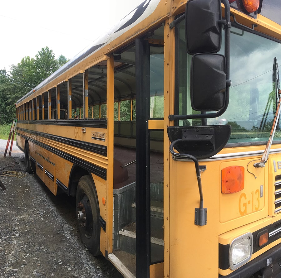 yellow school bus exterior before conversion