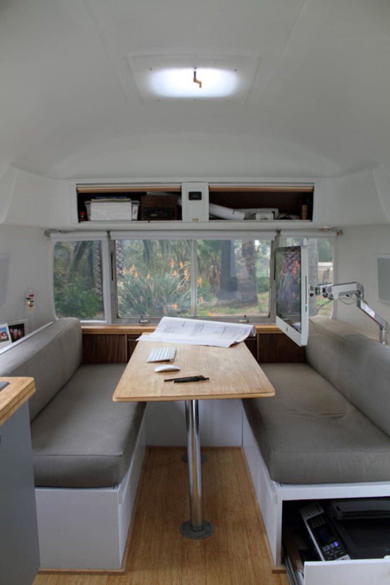 Airstream office with Mac attached to wall