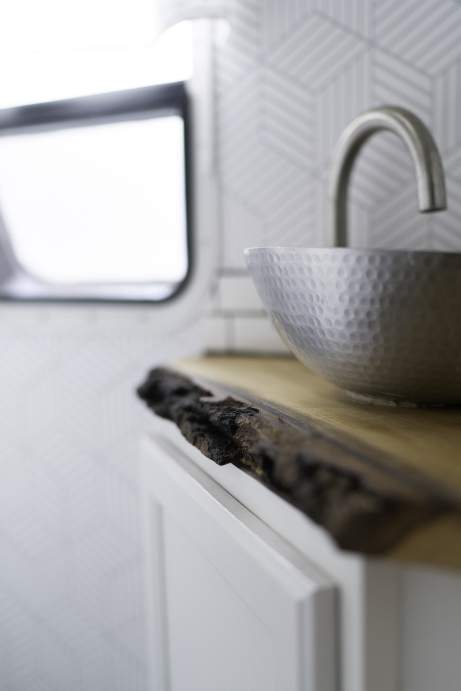 travel trailer bathroom remodel with live edge counter and vessel sink