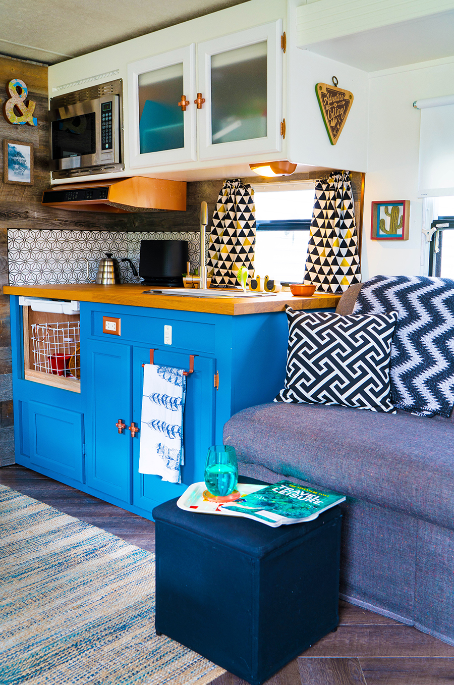 camper kitchen with blue cabinets