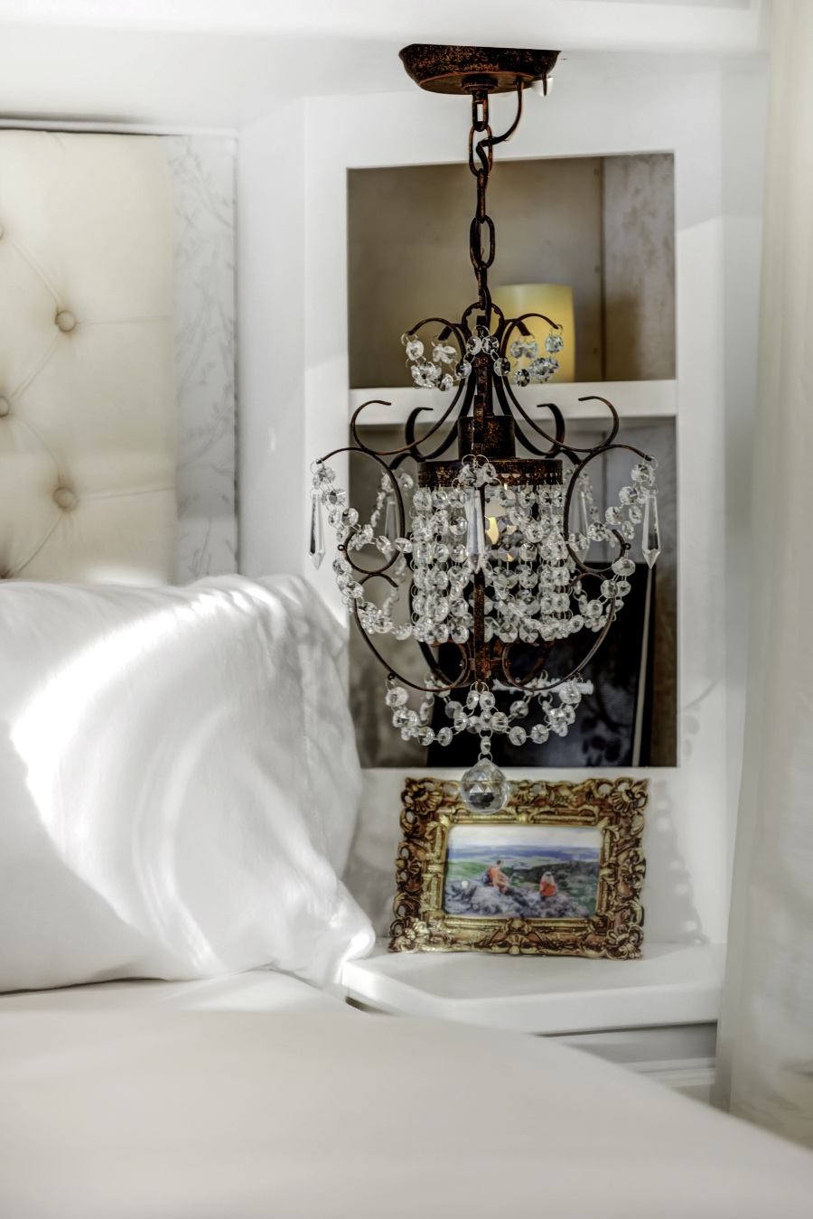 renovated RV bedroom with chandelier