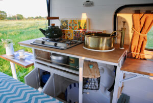 tiny kitchen inside renovated van