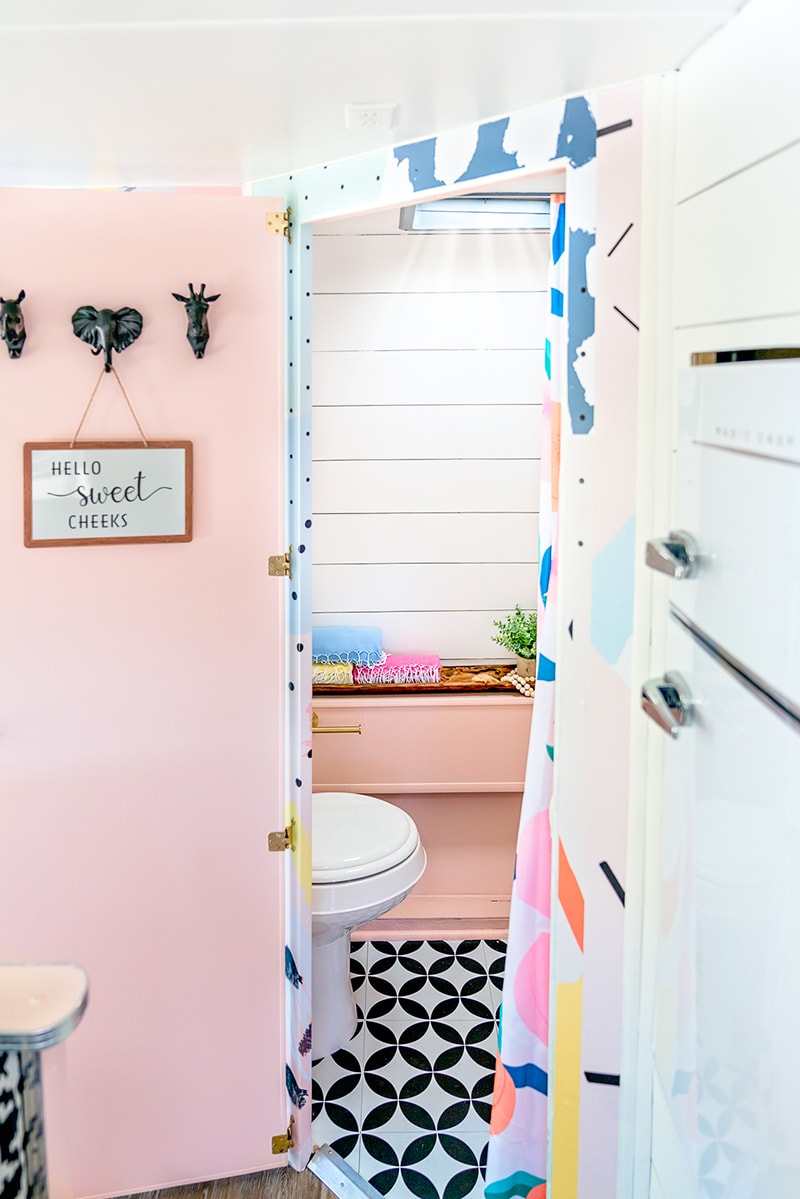 The playful interior of this vintage camper renovation was inspired by abstract pop wallpaper