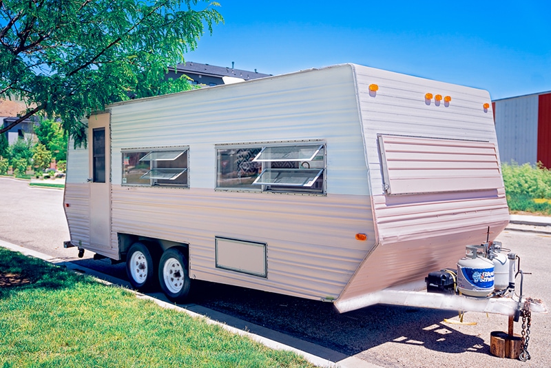 pink and white vintage camper exterior