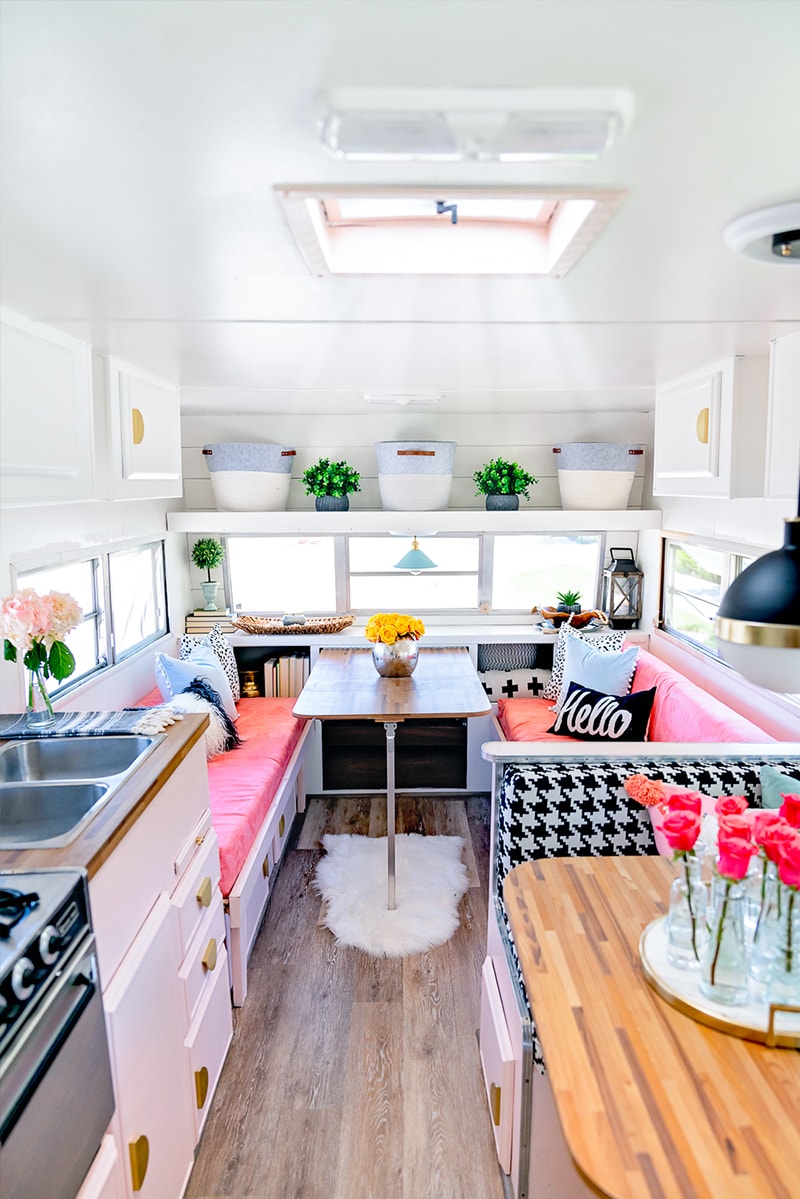 The playful interior of this vintage camper renovation was inspired by abstract pop wallpaper