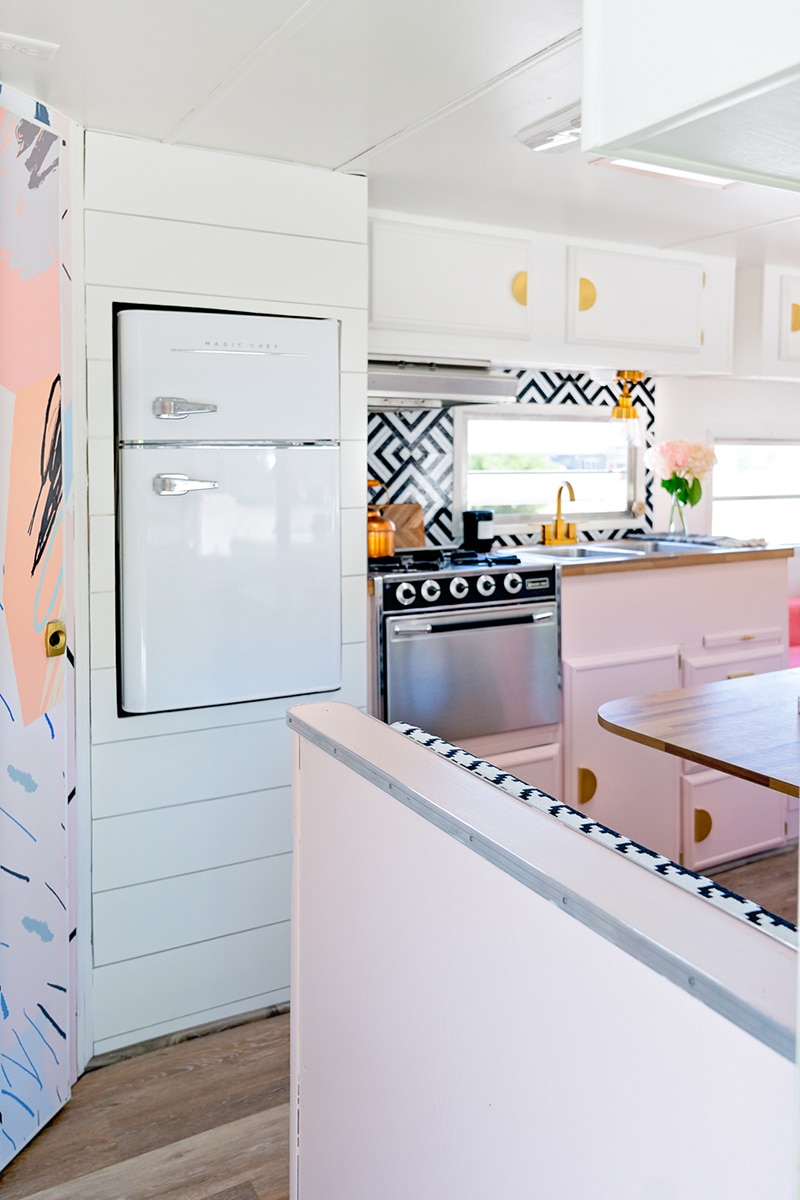 colorful camper with vintage inspired fridge