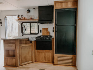 travel trailer kitchen remodel with unpainted cabinets