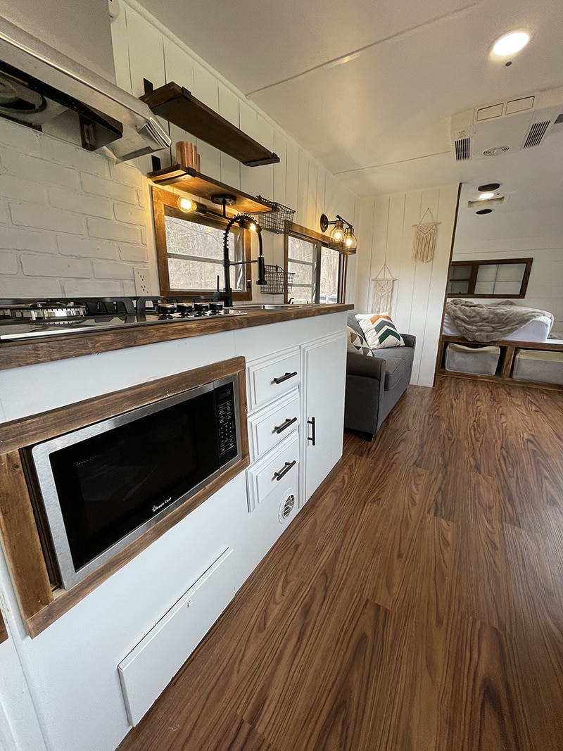 Tour this family-friendly camper remodel that includes a DIY epoxy shower