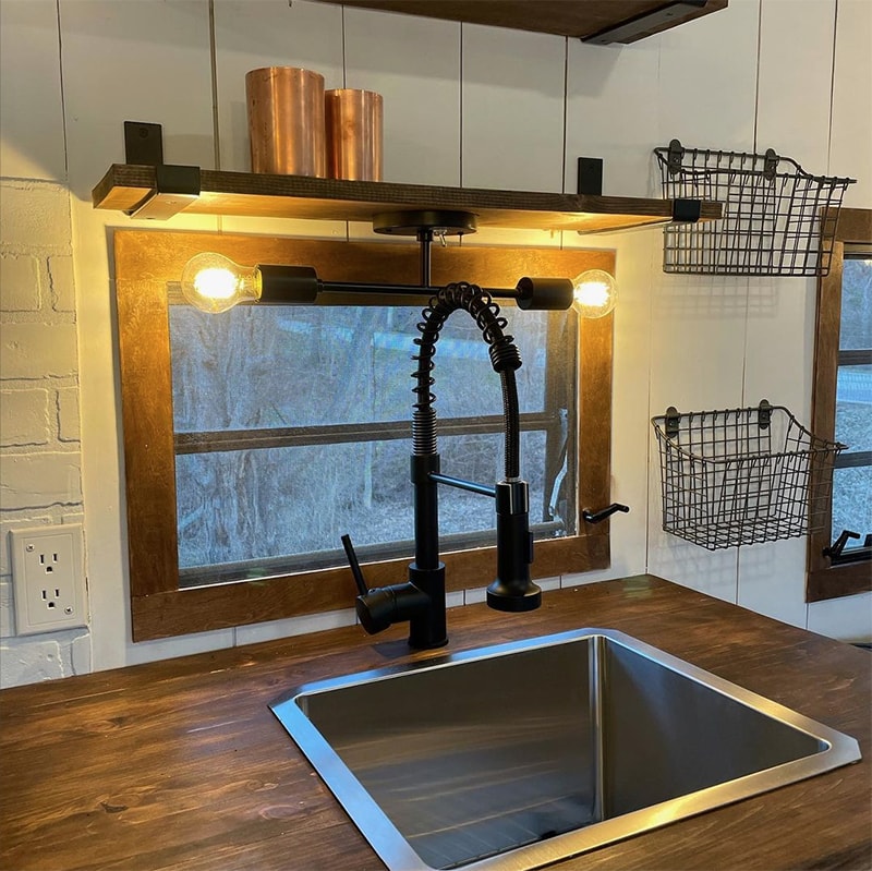 Tour this family-friendly camper remodel that includes a DIY epoxy shower