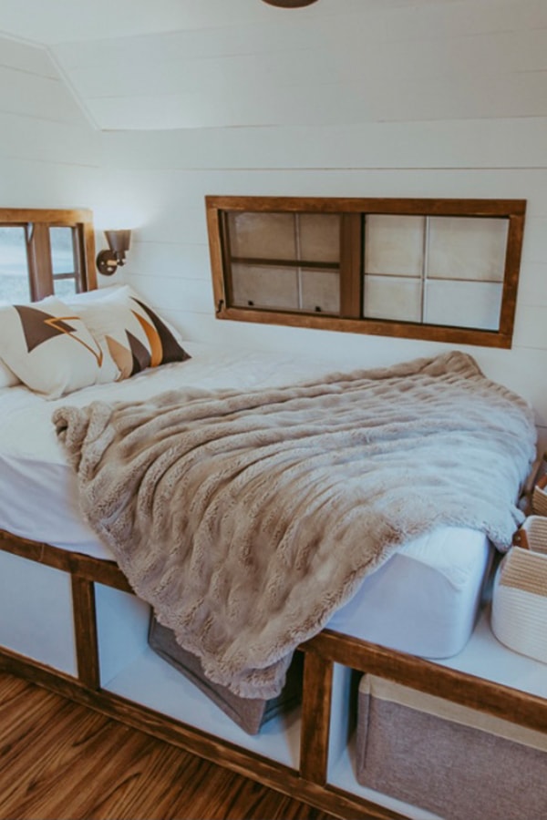 Tour this family-friendly camper remodel that includes a DIY epoxy shower