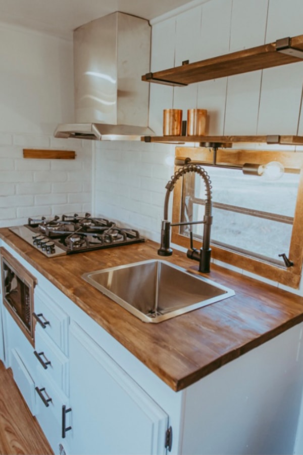 Tour this family-friendly camper remodel that includes a DIY epoxy shower