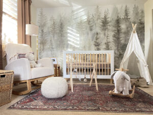 gender neutral nursery with evergreen trees wallpaper
